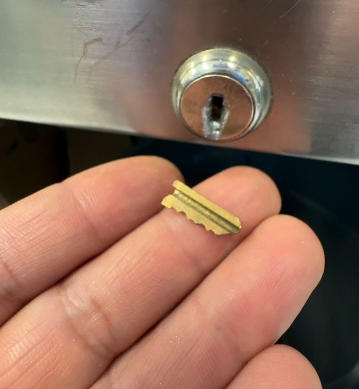 The broken key piece pulled out and the keyway clear, Charlotte NC